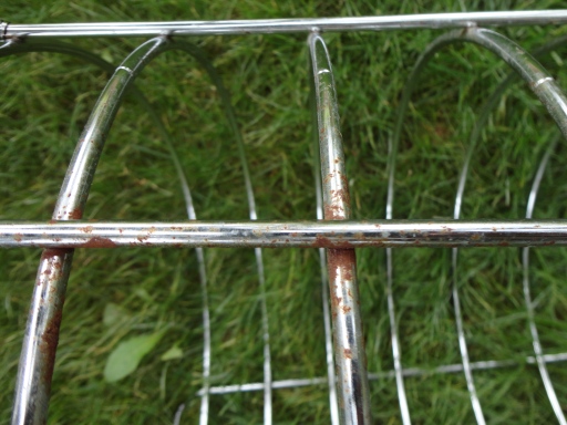 rusty chrome metal laundry basket