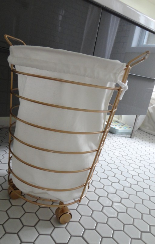 gold painted metal laundry basket